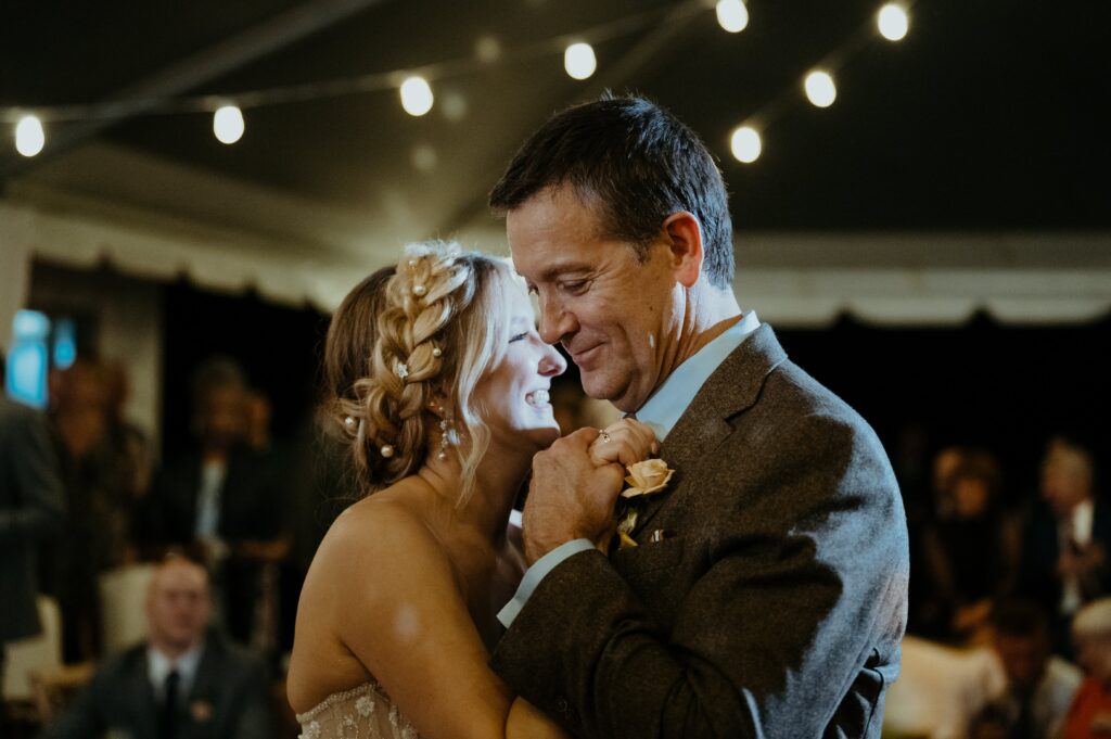 Father daughter first dance under the disco balls