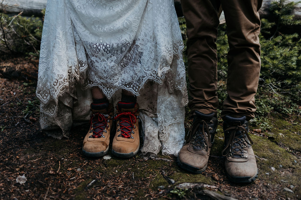 Details of newlyweds boots and dirty dress after their mountain elopement