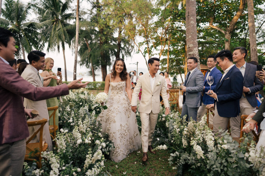 phuket thailand wedding couple wqalking down the isle 